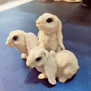 Set of 3 Holland Lop Eared Rabbits made of ceramic or resin. Stands 3.5"W x 5" L